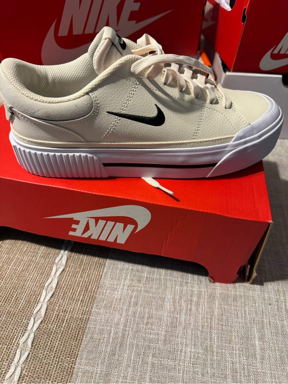 Nike Cream Low-Top Sneakers with Black Swoosh and White Sole